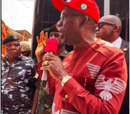 Governor Charles Soludo standing at Onitsha Main Market, addressing traders and security officials while announcing the one-week market shutdown directive.