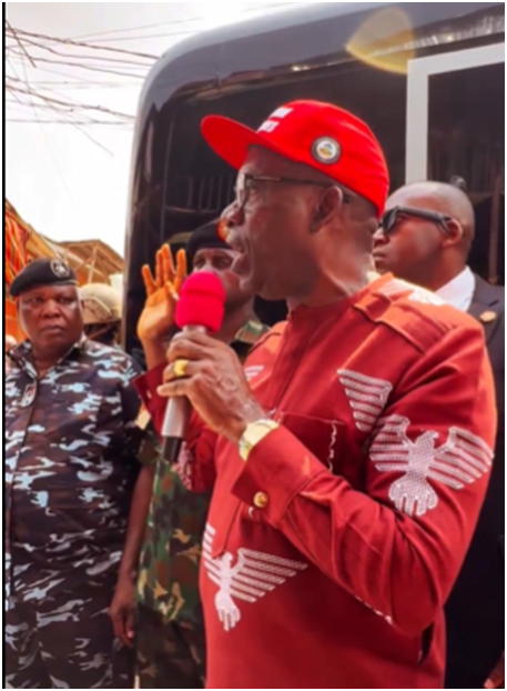 Governor Charles Soludo standing at Onitsha Main Market, addressing traders and security officials while announcing the one-week market shutdown directive.