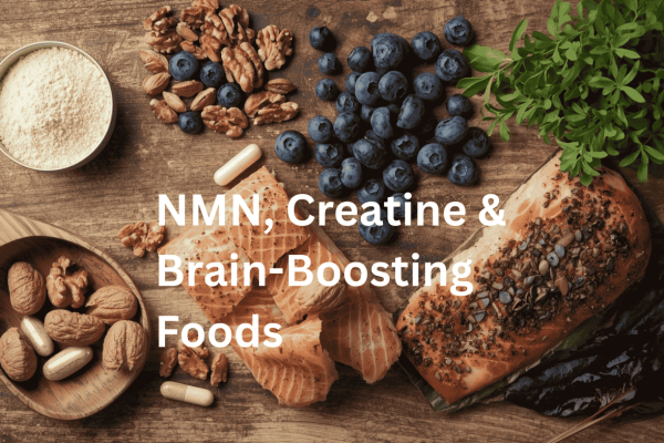 Assortment of brain-boosting supplements and foods including NMN powder, creatine capsules, walnuts, blueberries, salmon, and dark leafy greens arranged on a wooden surface.