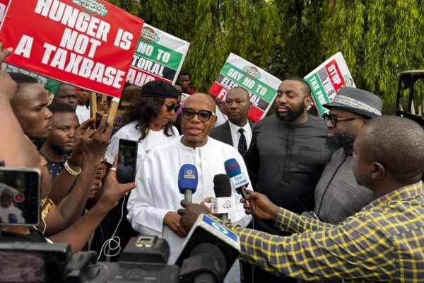 ormer Minister of Transportation and ex-Rivers State Governor Rotimi Amaechi speaking to protesters outside the National Assembly complex in Abuja during demonstrations demanding mandatory real-time electronic transmission of election results.
